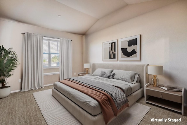 bedroom featuring baseboards, carpet flooring, and lofted ceiling