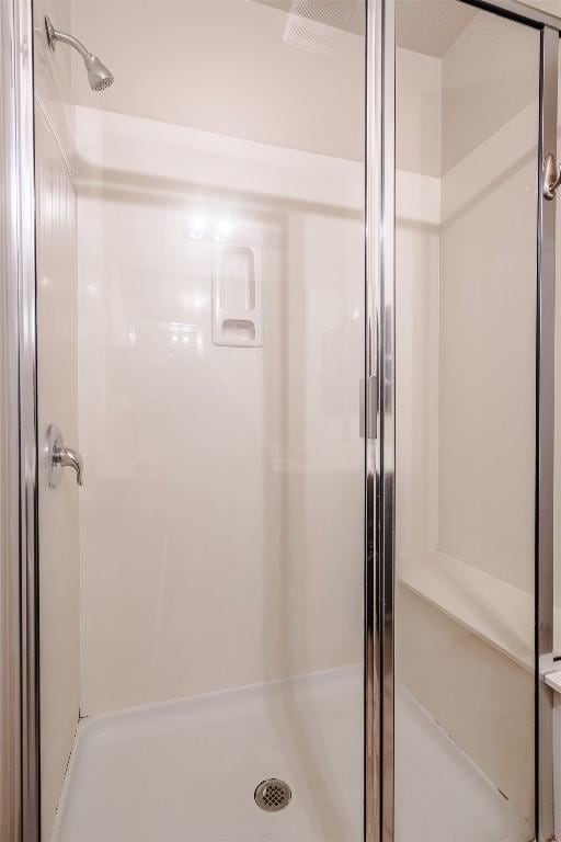 2880UNIT3401 Donnell Dr Unit 3401, Round Rock, TX 78664 - full bathroom featuring a stall shower