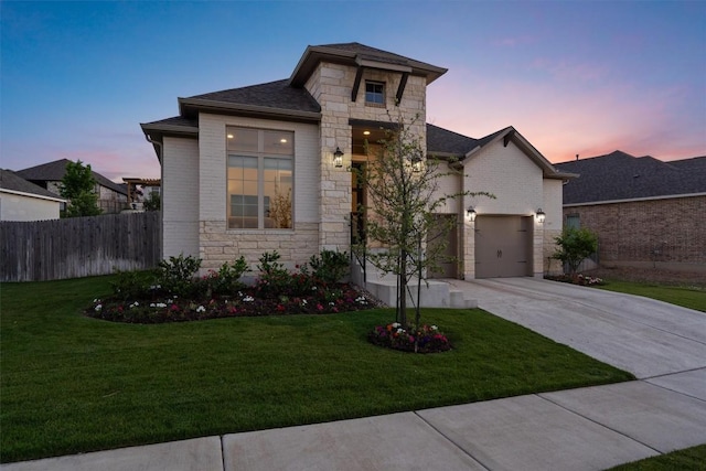 171 William Clayton Dr, Buda, TX 78610 - view of front of home with stone siding, driveway, a garage, brick siding, and roof with shingles
