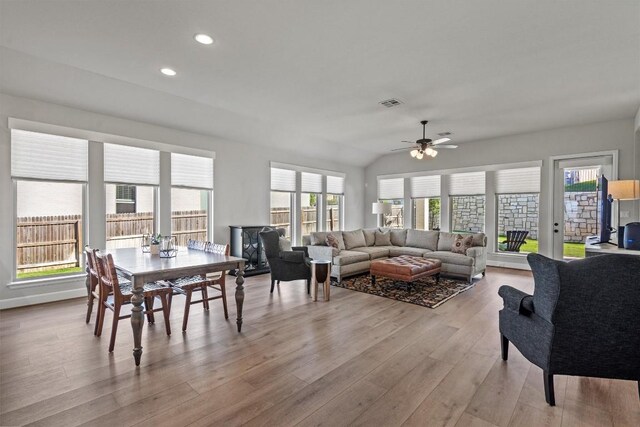 171 William Clayton Dr, Buda, TX 78610 - living area featuring ceiling fan, light wood finished floors, recessed lighting, healthy amount of natural light, and vaulted ceiling