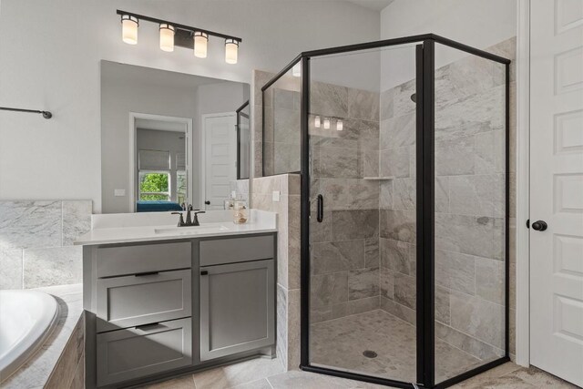 171 William Clayton Dr, Buda, TX 78610 - full bath with a bath, a stall shower, and vanity