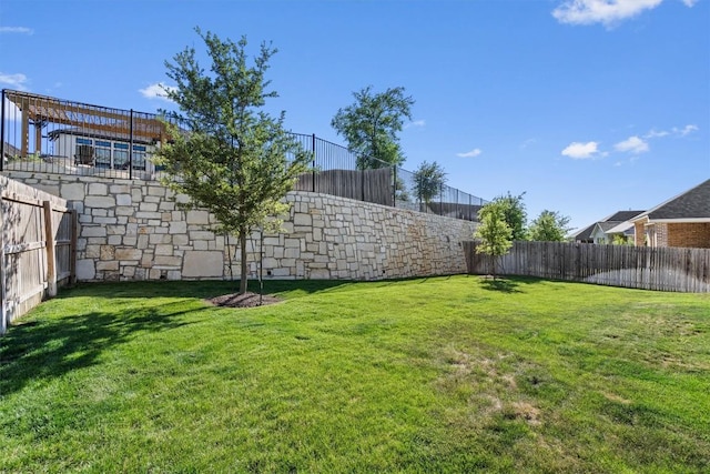 view of yard with a fenced backyard