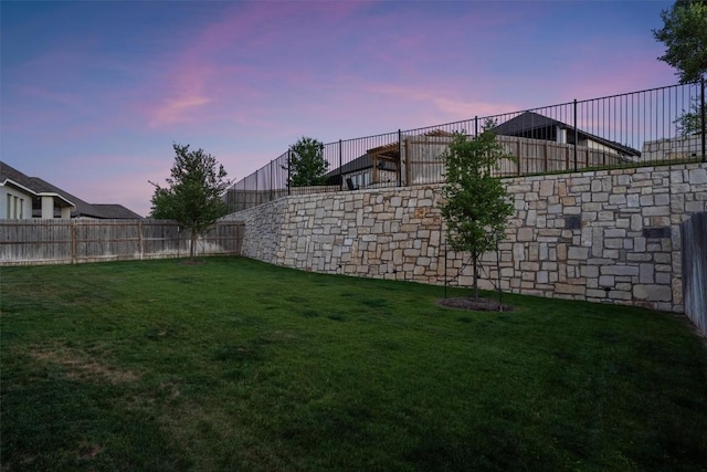 view of yard with a fenced backyard
