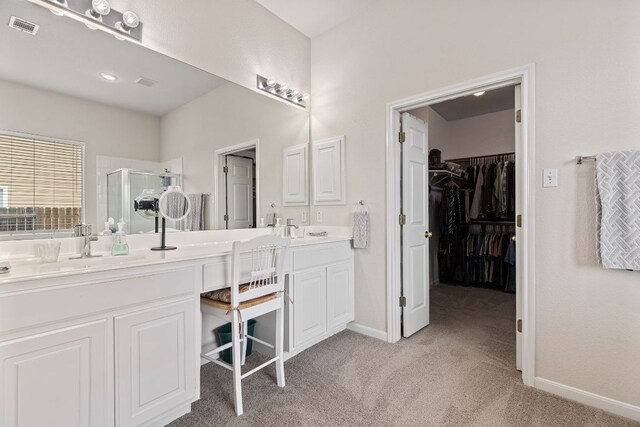 117 Summers Grn, Georgetown, TX 78633 - full bathroom with a stall shower, double vanity, baseboards, and a spacious closet