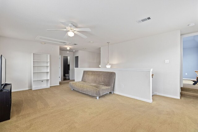 117 Summers Grn, Georgetown, TX 78633 - sitting room with attic access, light colored carpet, a ceiling fan, and baseboards