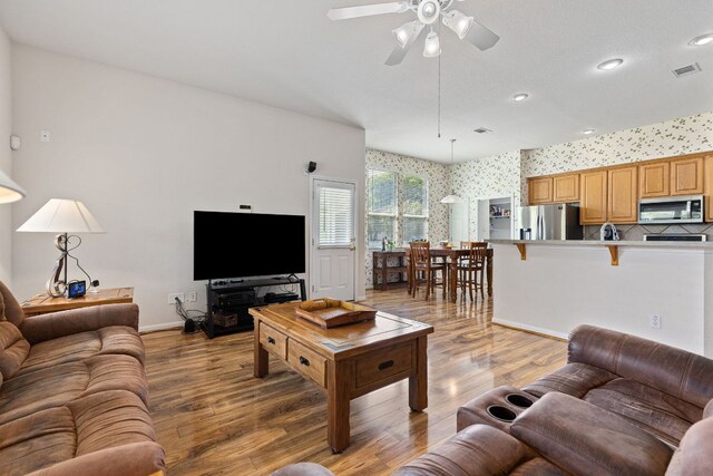 117 Summers Grn, Georgetown, TX 78633 - living room with wallpapered walls, ceiling fan, light wood-style flooring, recessed lighting, and baseboards