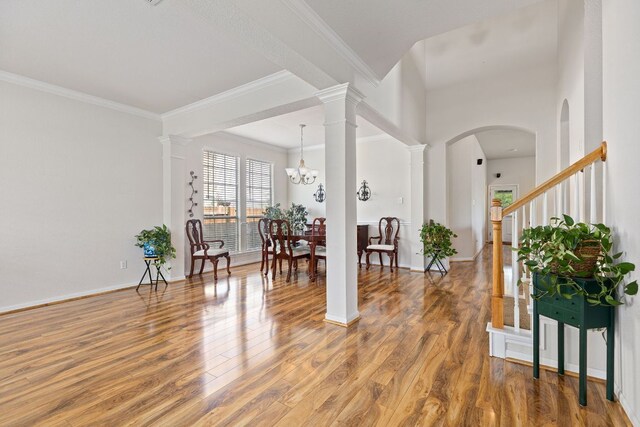 117 Summers Grn, Georgetown, TX 78633 - entryway featuring light wood finished floors, crown molding, decorative columns, and baseboards