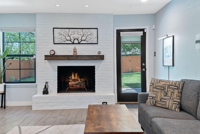 713 Buckingham Pl, Austin, TX 78745 - living room with a fireplace, recessed lighting, wood finished floors, and a wealth of natural light