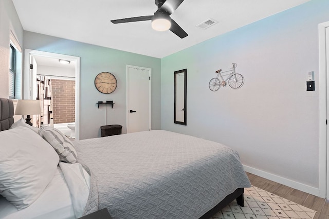 713 Buckingham Pl, Austin, TX 78745 - bedroom with visible vents, baseboards, a ceiling fan, light wood-style flooring, and ensuite bath