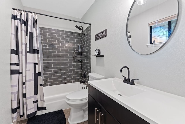 713 Buckingham Pl, Austin, TX 78745 - bathroom featuring vanity, toilet, a textured wall, and shower / tub combo