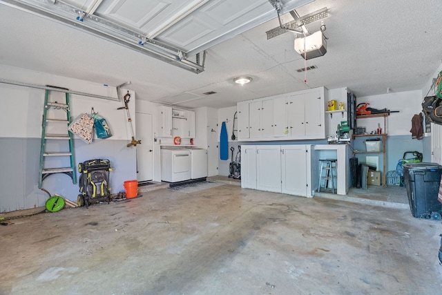 713 Buckingham Pl, Austin, TX 78745 - garage featuring independent washer and dryer and a garage door opener