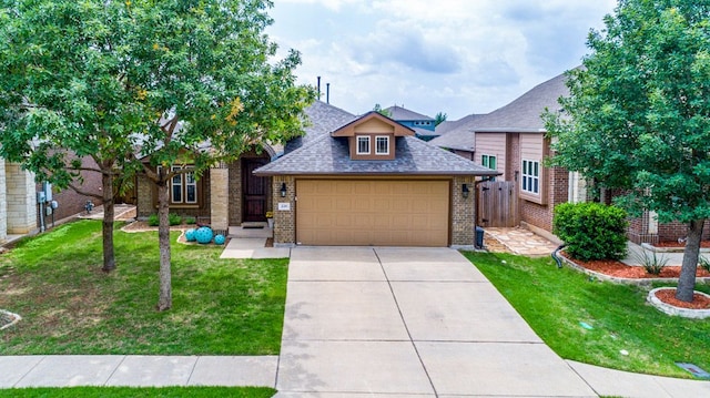 view of front facade featuring a garage, a front lawn, fence, roof with shingles, and brick siding