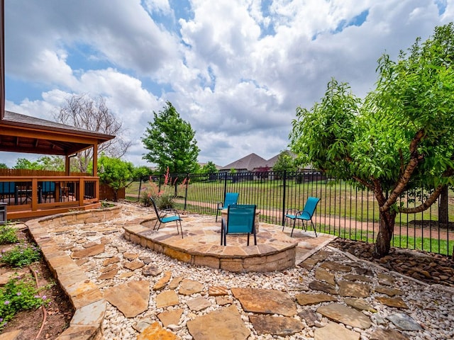 view of patio featuring fence