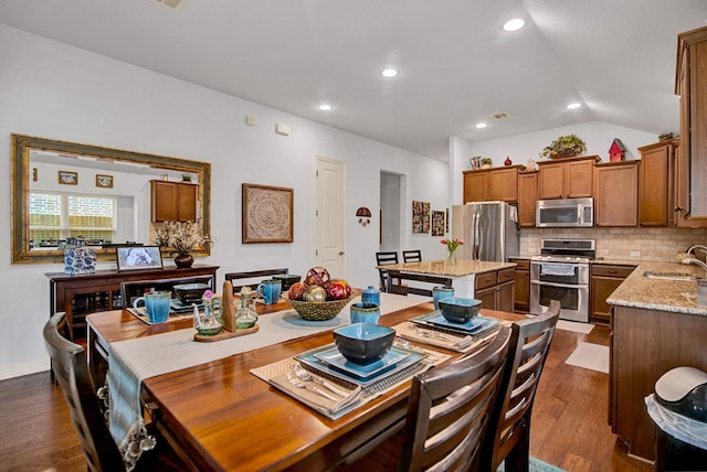 dining space featuring recessed lighting, visible vents, dark wood-style floors, and lofted ceiling