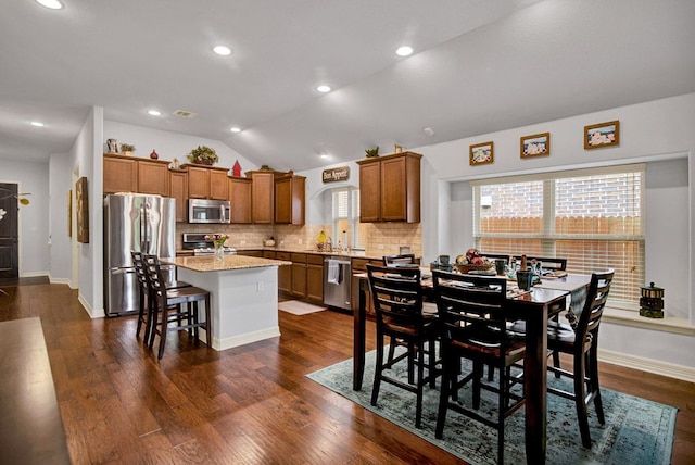 dining area with recessed lighting, visible vents, dark wood-style floors, and lofted ceiling