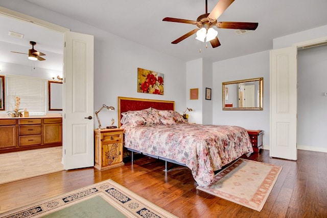 bedroom featuring baseboards, ceiling fan, and hardwood / wood-style flooring