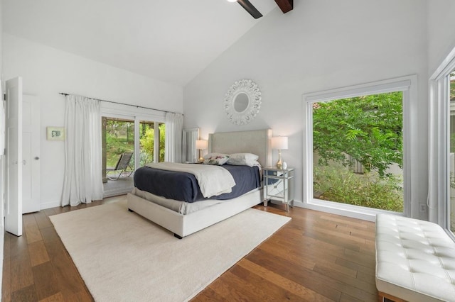 bedroom featuring high vaulted ceiling, access to exterior, wood finished floors, and multiple windows