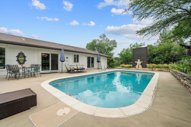 outdoor pool featuring a patio