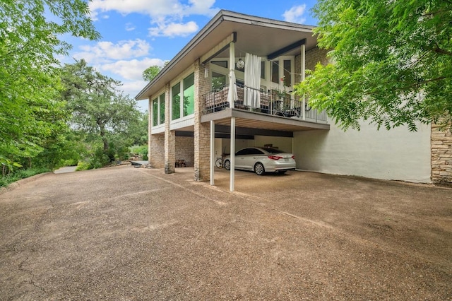 419 Sunfish St, Lakeway, TX 78734 - back of house with driveway and a carport