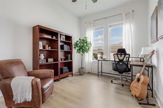 office area with ceiling fan and light wood-style flooring