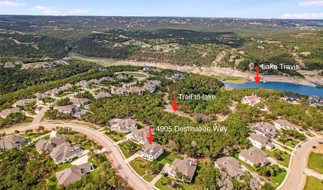 birds eye view of property featuring a residential view and a water view