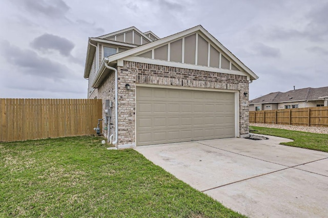 garage featuring fence and driveway