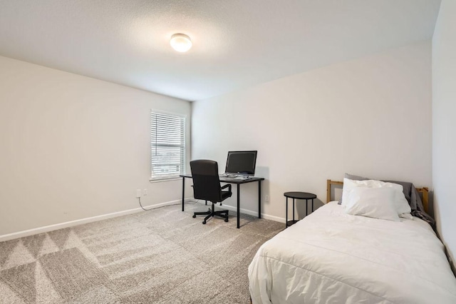 bedroom featuring carpet flooring and baseboards