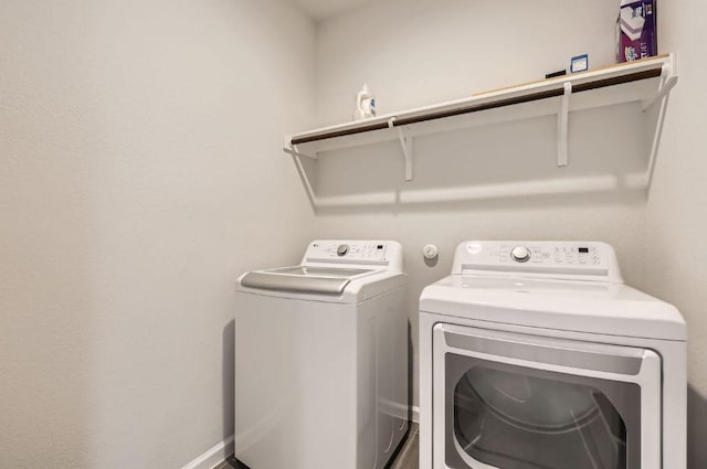 clothes washing area featuring laundry area and independent washer and dryer