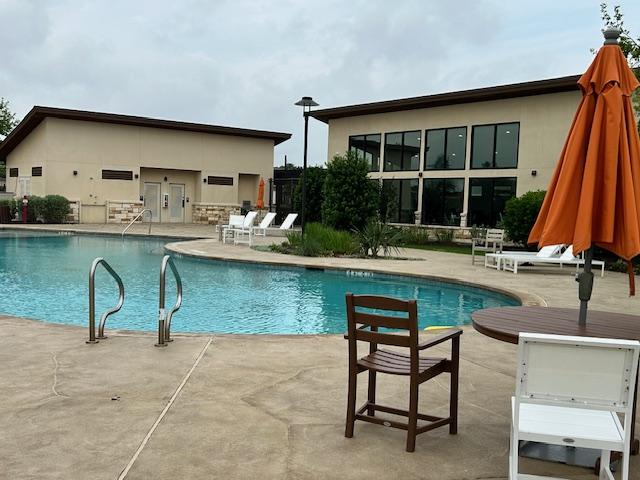 pool with a patio area