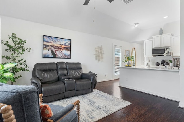 173 Venti Cv, Georgetown, TX 78628 - living area featuring visible vents, dark wood-style flooring, lofted ceiling, baseboards, and ceiling fan