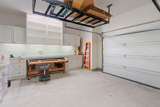 173 Venti Cv, Georgetown, TX 78628 - garage featuring a workshop area
