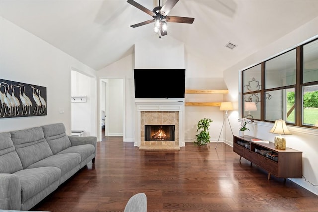 living room featuring a fireplace, high vaulted ceiling, a ceiling fan, wood finished floors, and visible vents