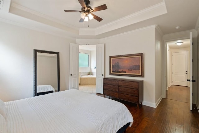 15105 Falcon Dr, Austin, TX 78734 - bedroom with a raised ceiling, wood-type flooring, crown molding, ensuite bath, and a ceiling fan