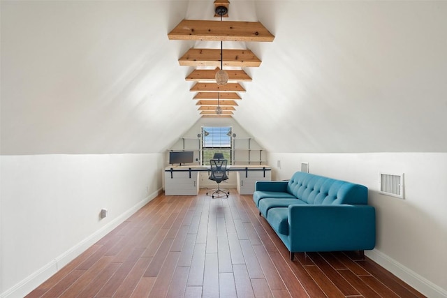 living area with visible vents, baseboards, lofted ceiling, and wood finished floors