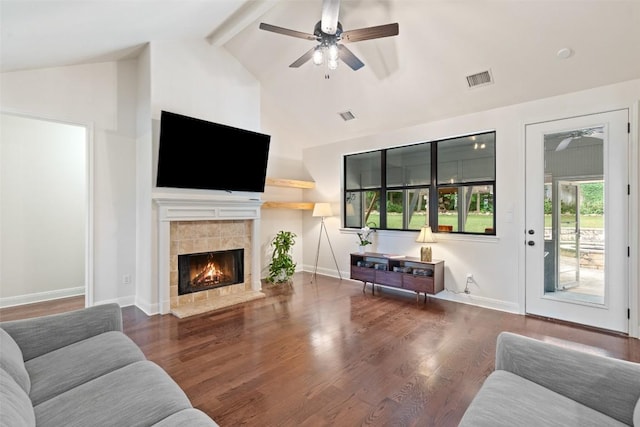 living room with ceiling fan, visible vents, beam ceiling, and high vaulted ceiling