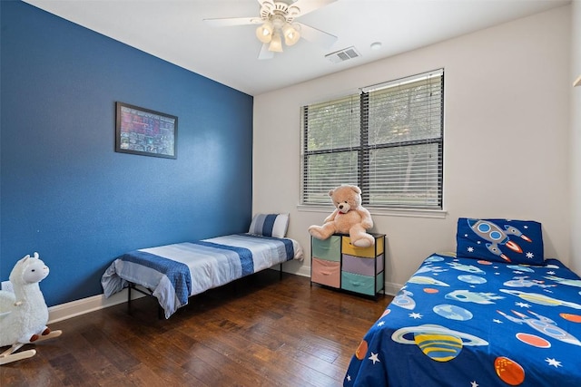 bedroom with visible vents, wood-type flooring, ceiling fan, and baseboards