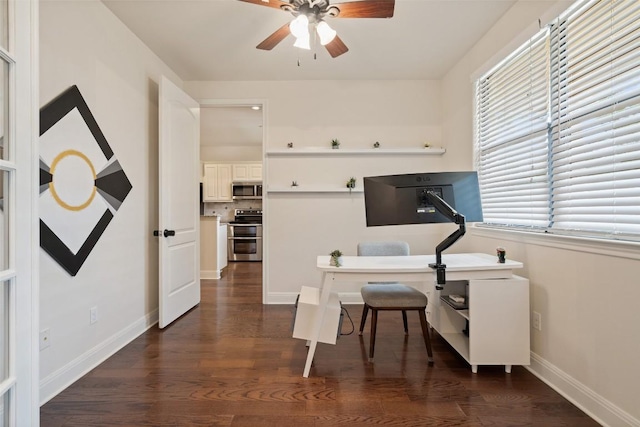 office with a ceiling fan, baseboards, and dark wood-style floors