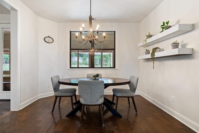 dining space featuring baseboards, visible vents, dark wood-style flooring, and a chandelier