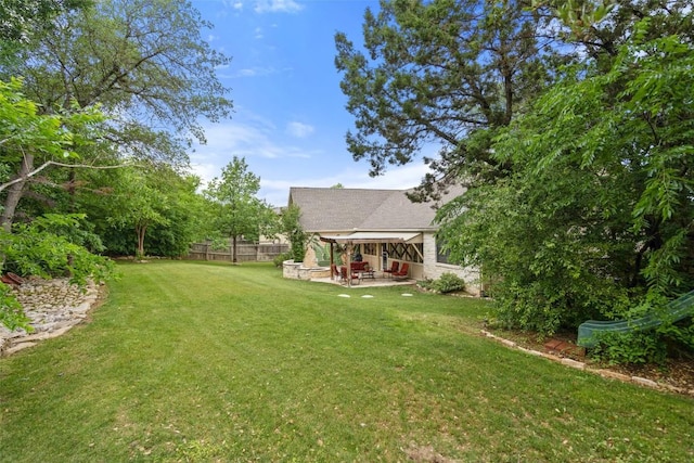 view of yard featuring a patio area and fence