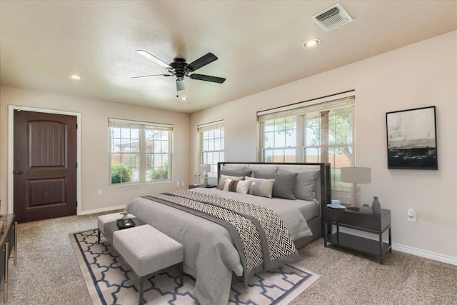 bedroom with carpet flooring, recessed lighting, baseboards, a ceiling fan, and visible vents