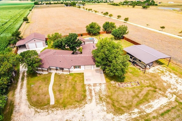 birds eye view of property with a rural view