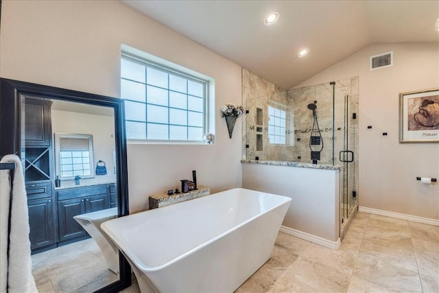 full bathroom featuring a soaking tub, visible vents, a wealth of natural light, and a stall shower