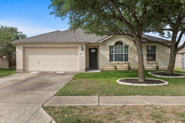 single story home featuring a garage, stone siding, concrete driveway, and a front yard