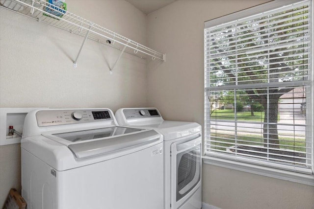 washroom featuring laundry area and washing machine and dryer