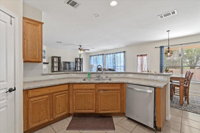 kitchen with visible vents, a healthy amount of sunlight, a sink, and dishwasher