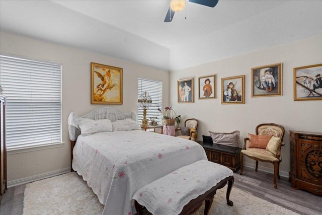 2302 Wheaton Trl, Cedar Park, TX 78613 - bedroom with baseboards, light wood-style flooring, and a ceiling fan