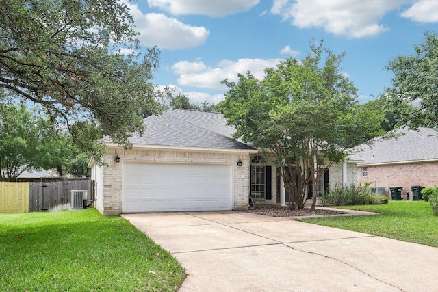 single story home with a garage, central air condition unit, fence, a front lawn, and concrete driveway