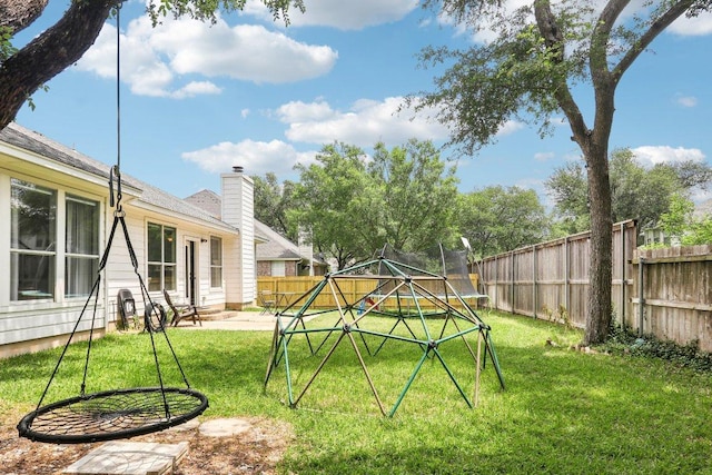 view of yard featuring a fenced backyard, a trampoline, and a patio area