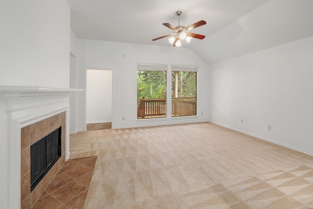 813 Westbury Ln, Georgetown, TX 78633 - unfurnished living room with a ceiling fan, carpet flooring, a tile fireplace, vaulted ceiling, and baseboards