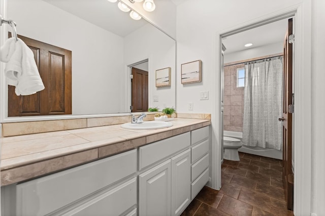bathroom featuring vanity, shower / bath combo, and toilet